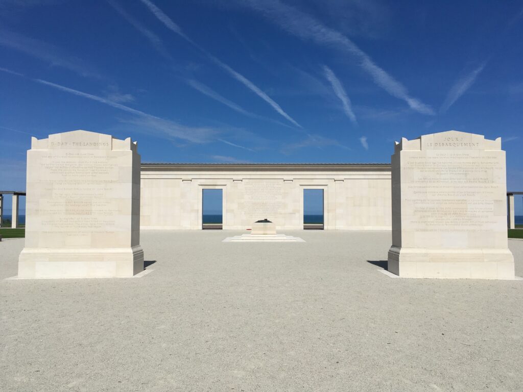 The inscription stones and colonnade of the British Normandy Memorial with the sea beyond